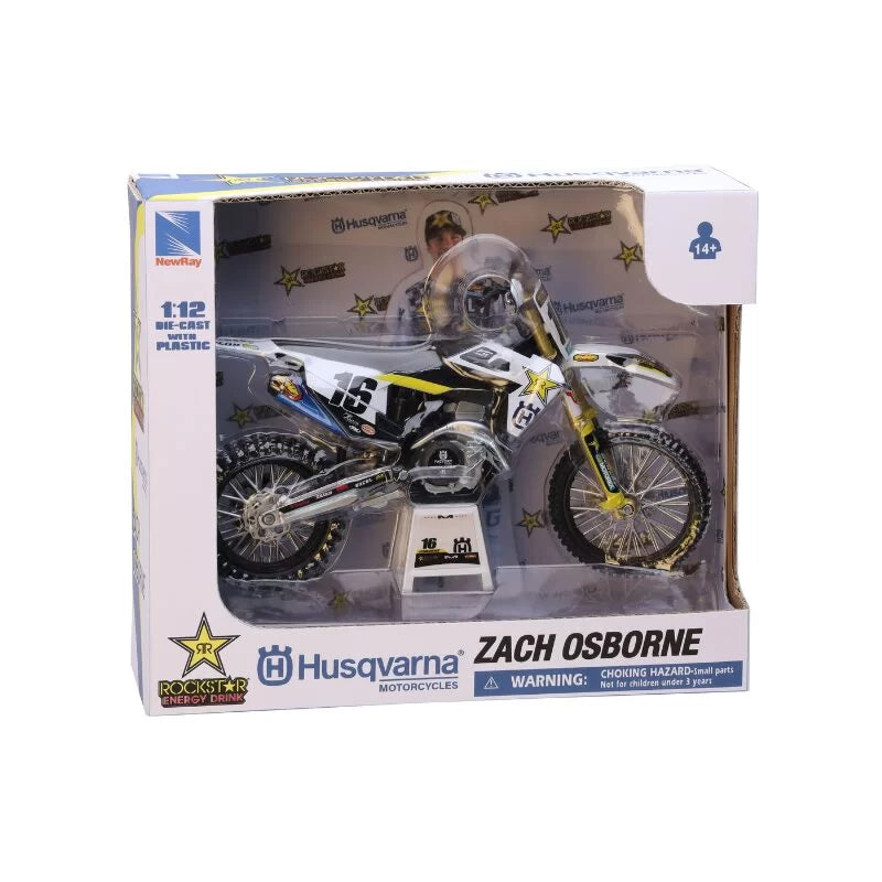 Model dirt bike in packaging with Husqvarna branding and Zach Osborne name.