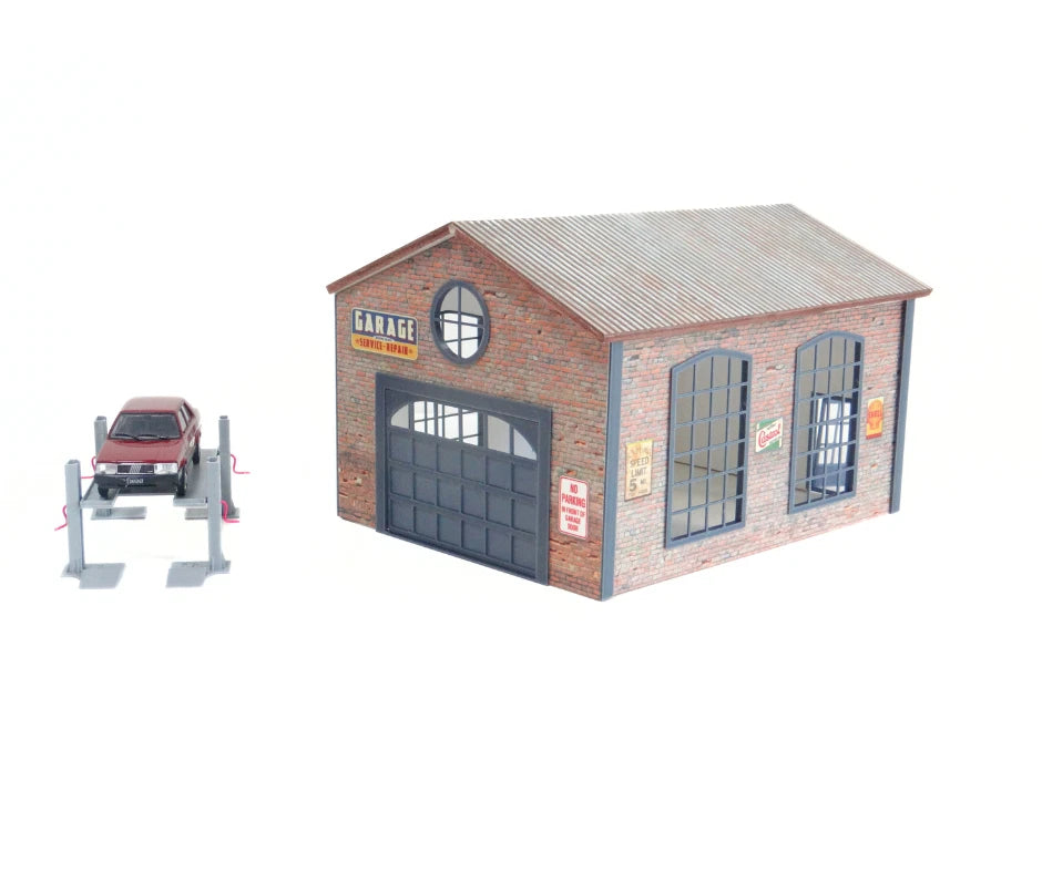 Model garage with a car on a white background