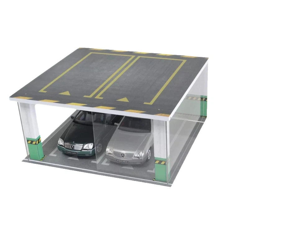 Model of a two-car underground parking garage with cars inside on a white background