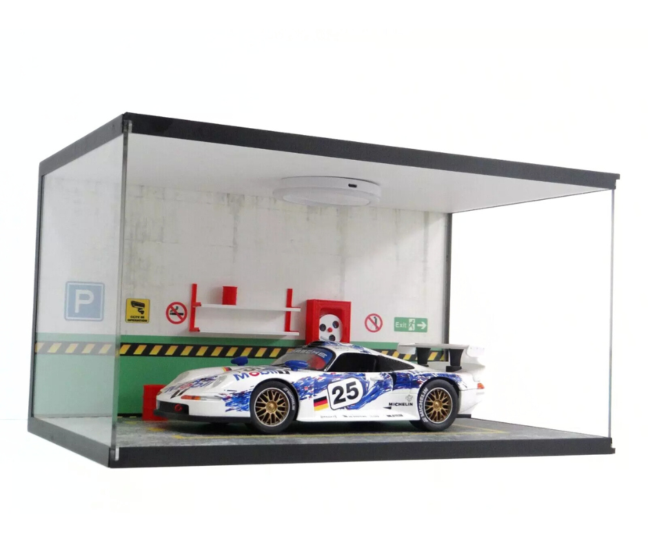 Model race car in a display case with a white background