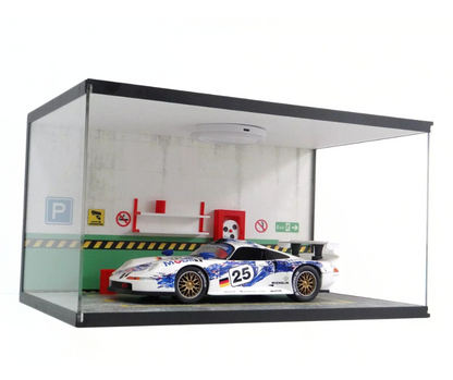 Model race car in a display case with a white background