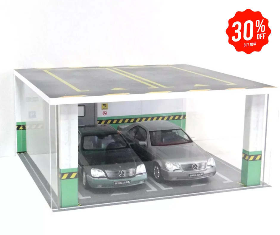 Acrylic display case with LED lighting, depicting a underground parking scene, showcasing two model cars.