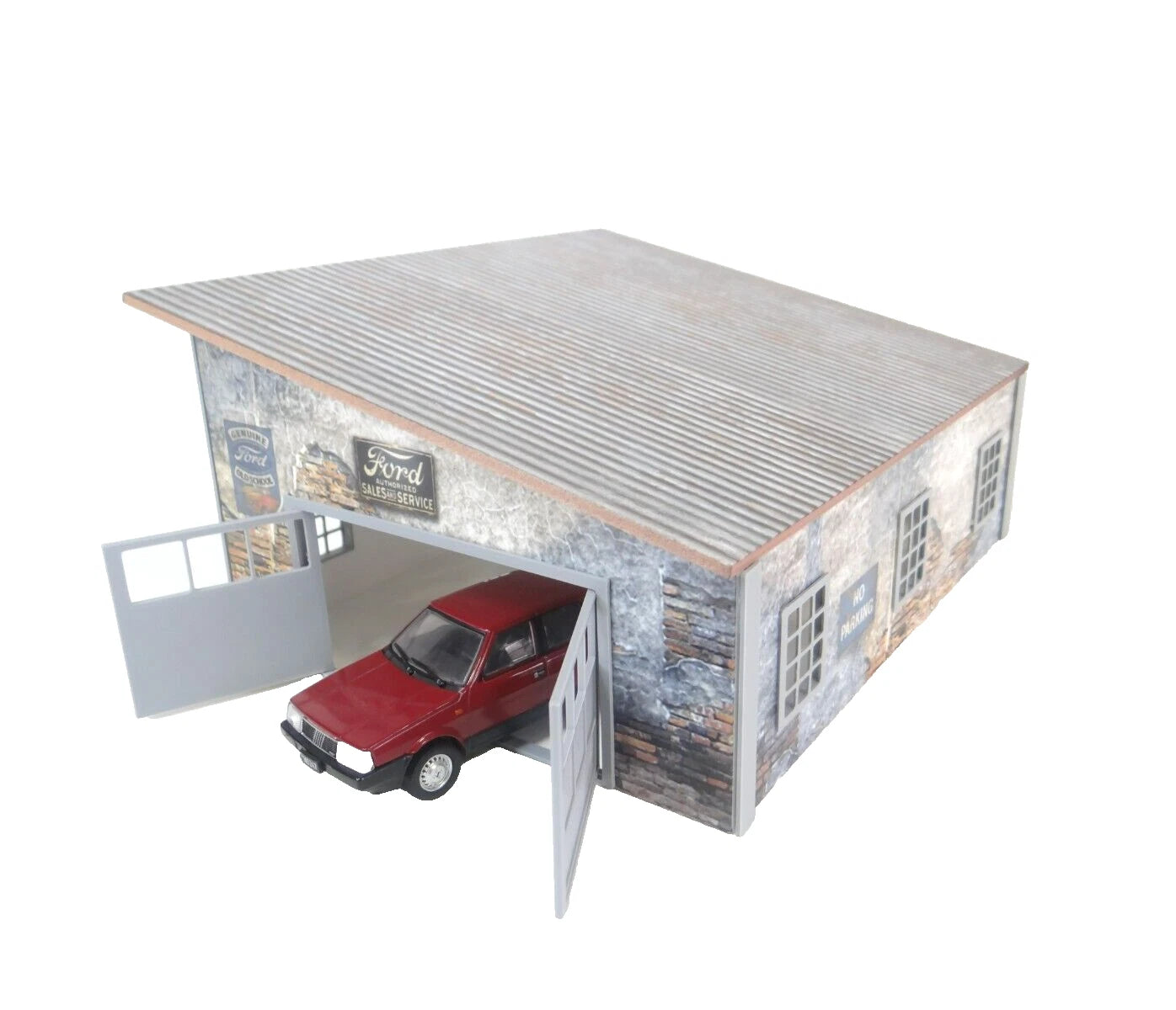 Model of a rustic garage with a red car inside on a white background